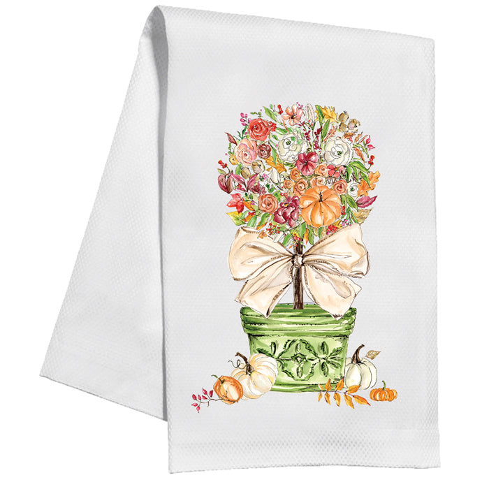 White towel with floral topiary design featuring pumpkins and a bow on a white background