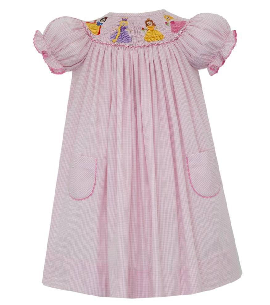 Pink dress with princesses on the chest against a white background