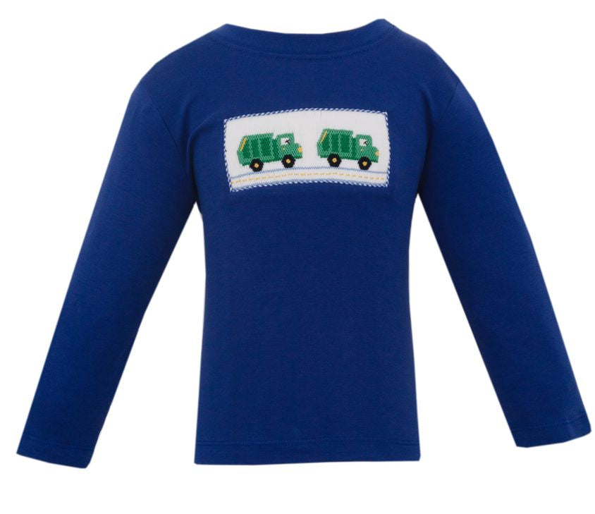 A royal blue long-sleeve shirt with a white rectangular patch on the chest featuring two green garbage trucks. A smaller inset image on the right shows a close-up of the patch.