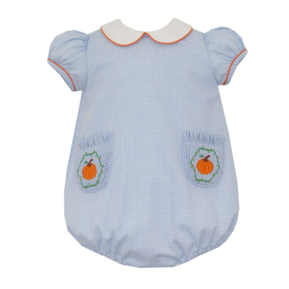 A baby romper in a light blue and white gingham pattern, featuring short puff sleeves, a white Peter Pan collar with orange trim, and two front pockets decorated with pumpkin designs and the word &