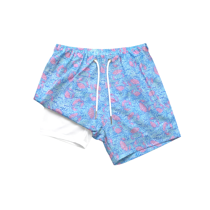 Blue shorts with pink patterns on a white background