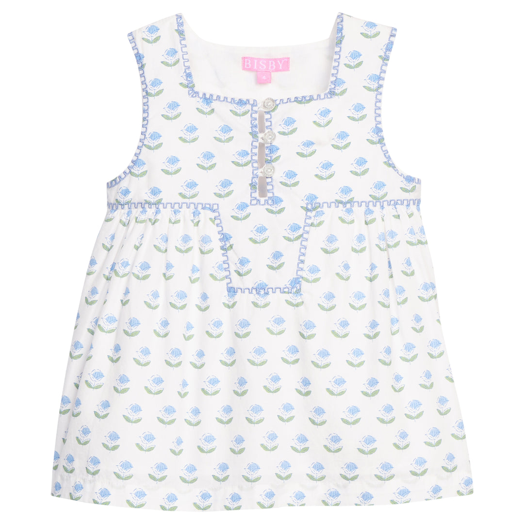 White dress with blue floral pattern on a white background