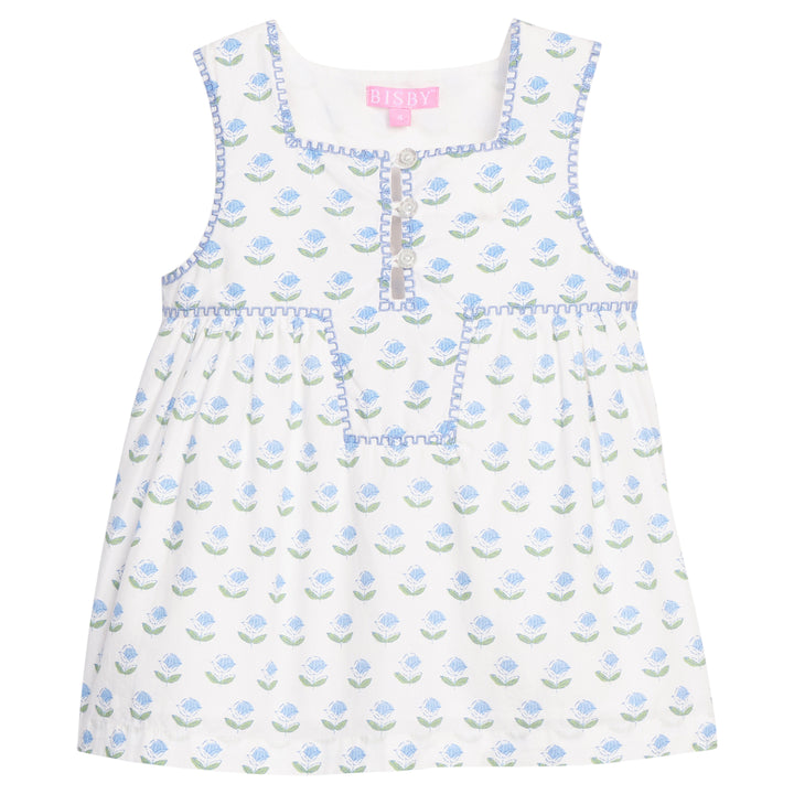 White dress with blue floral pattern on a white background