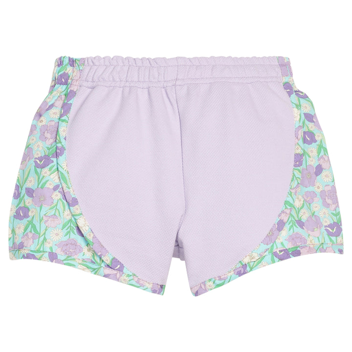 Lavender shorts with floral trim on a white background