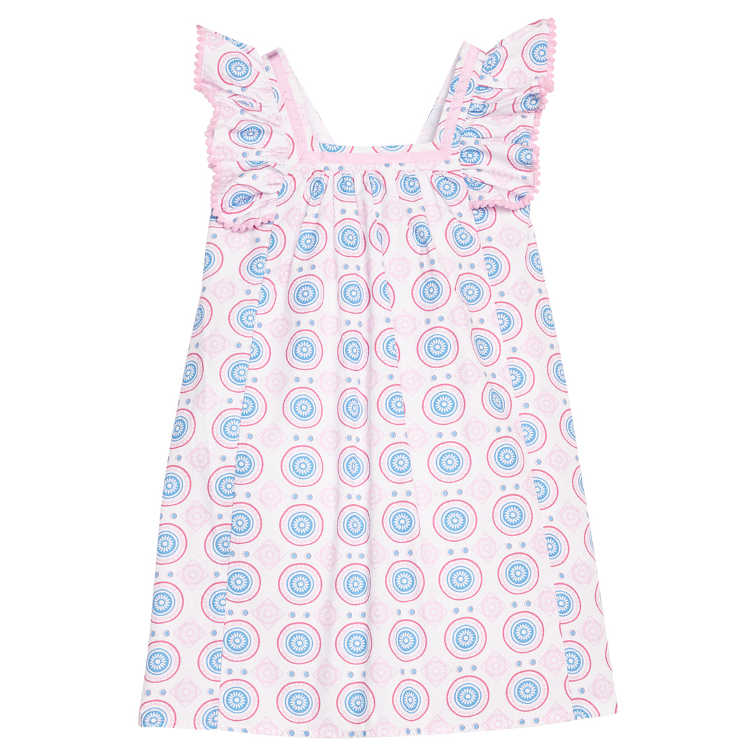 Pink dress with blue and red circular pattern on a white background