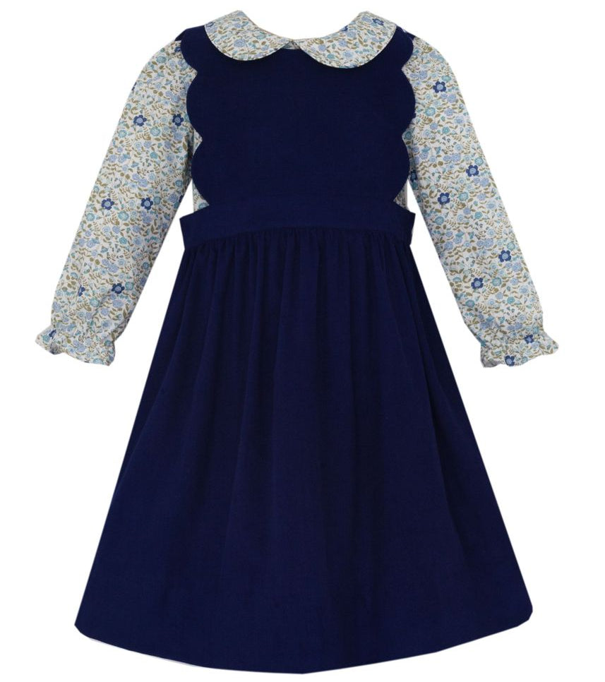 Navy blue dress with floral long-sleeve top on a white background
