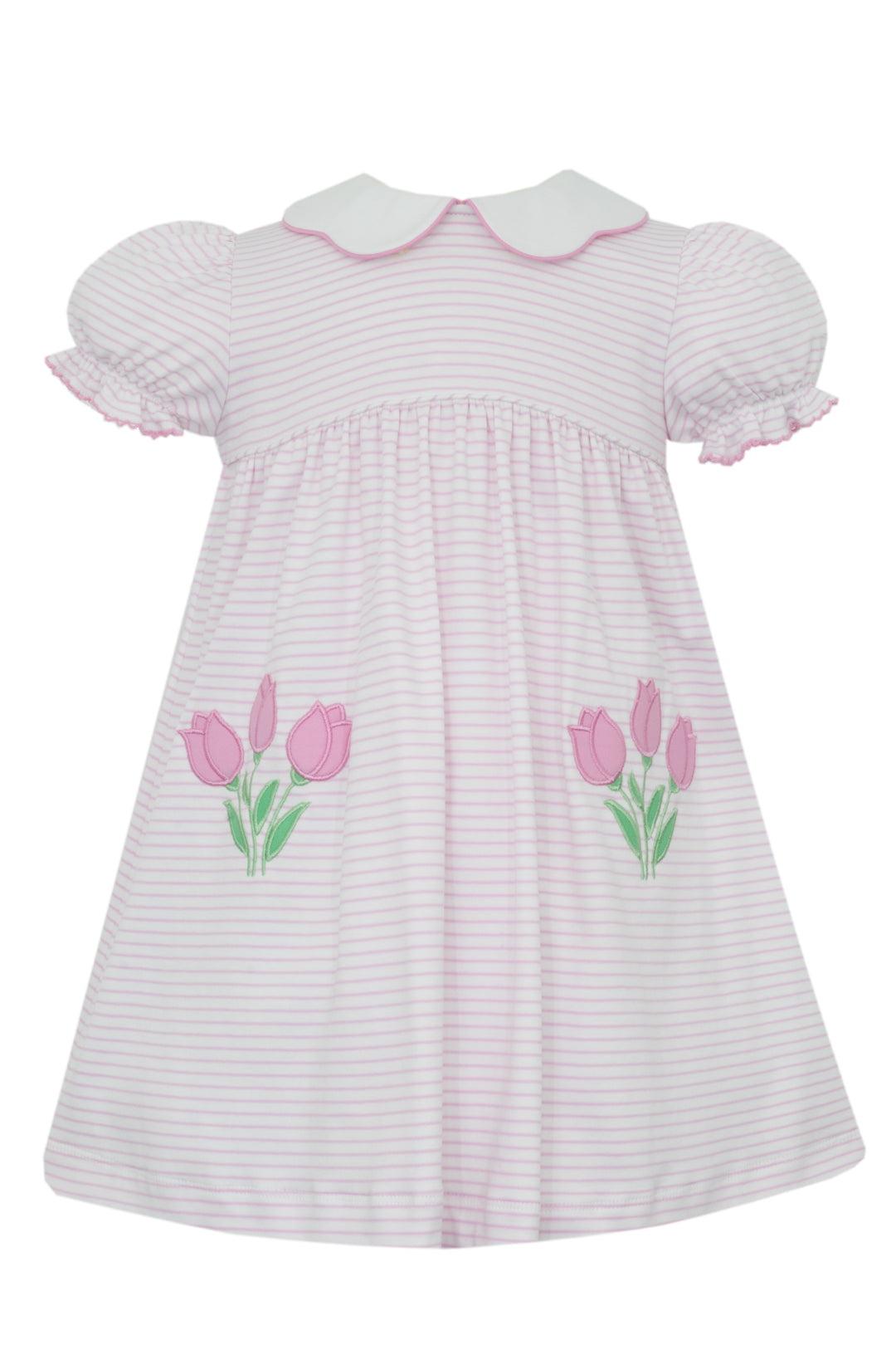 White dress with pink tulip designs on a white background