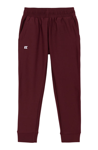 Maroon pants with a brand logo on a white background