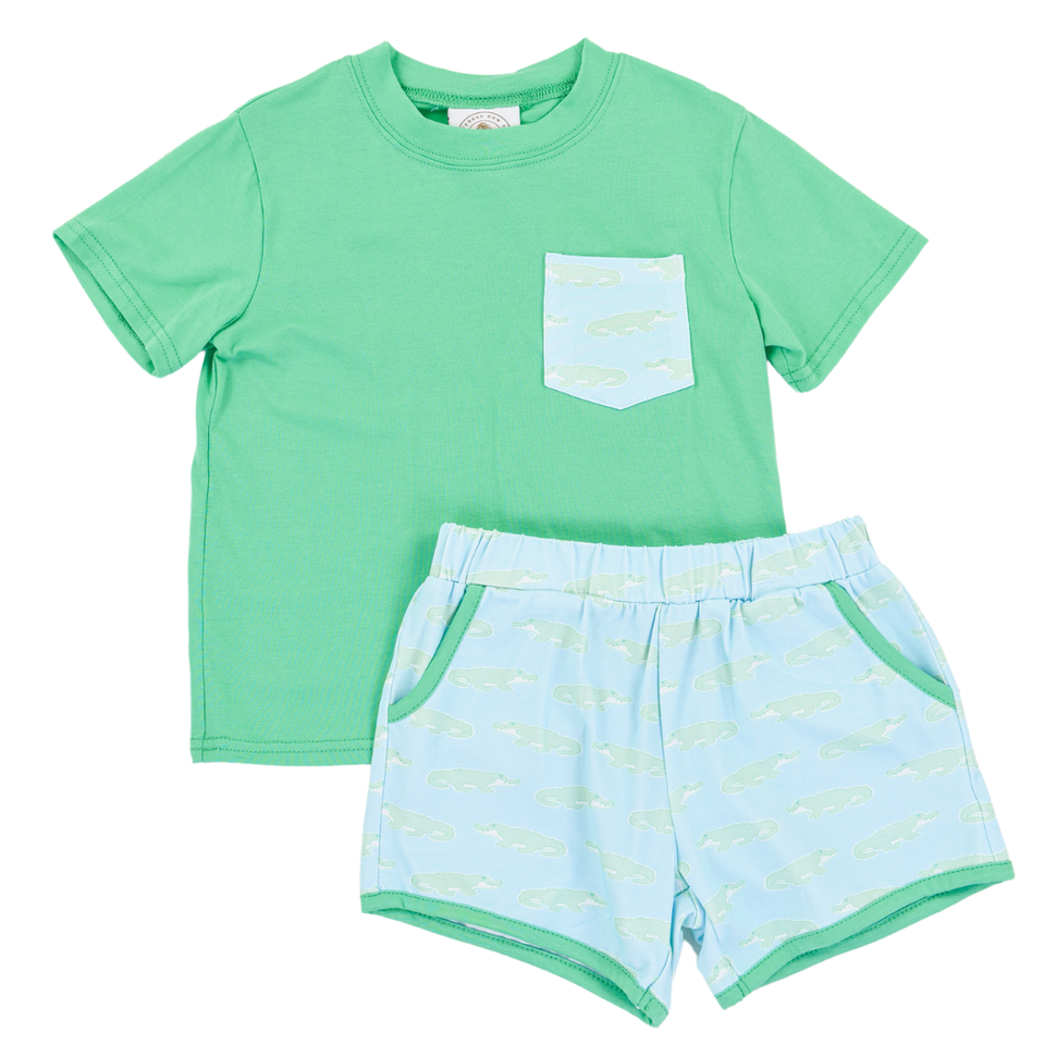 Children's green t-shirt and light blue shorts set on a white background