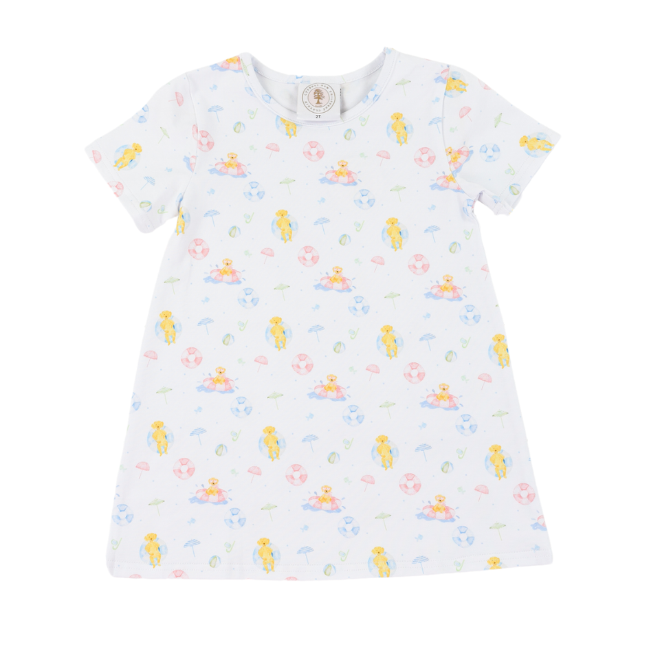 White dress with colorful dog pattern on a white background