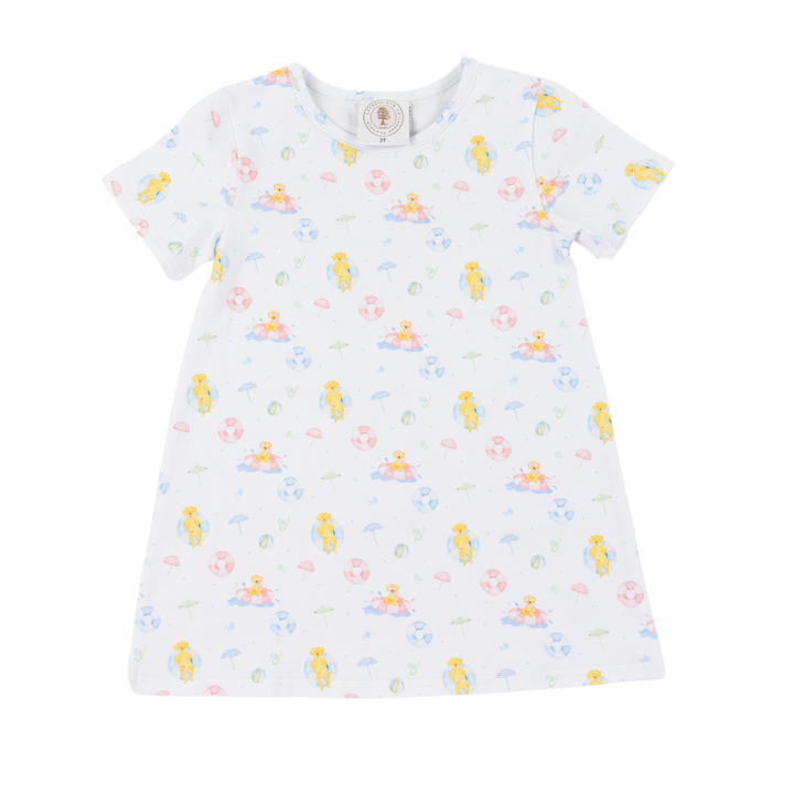 White dress with colorful dog pattern on a white background