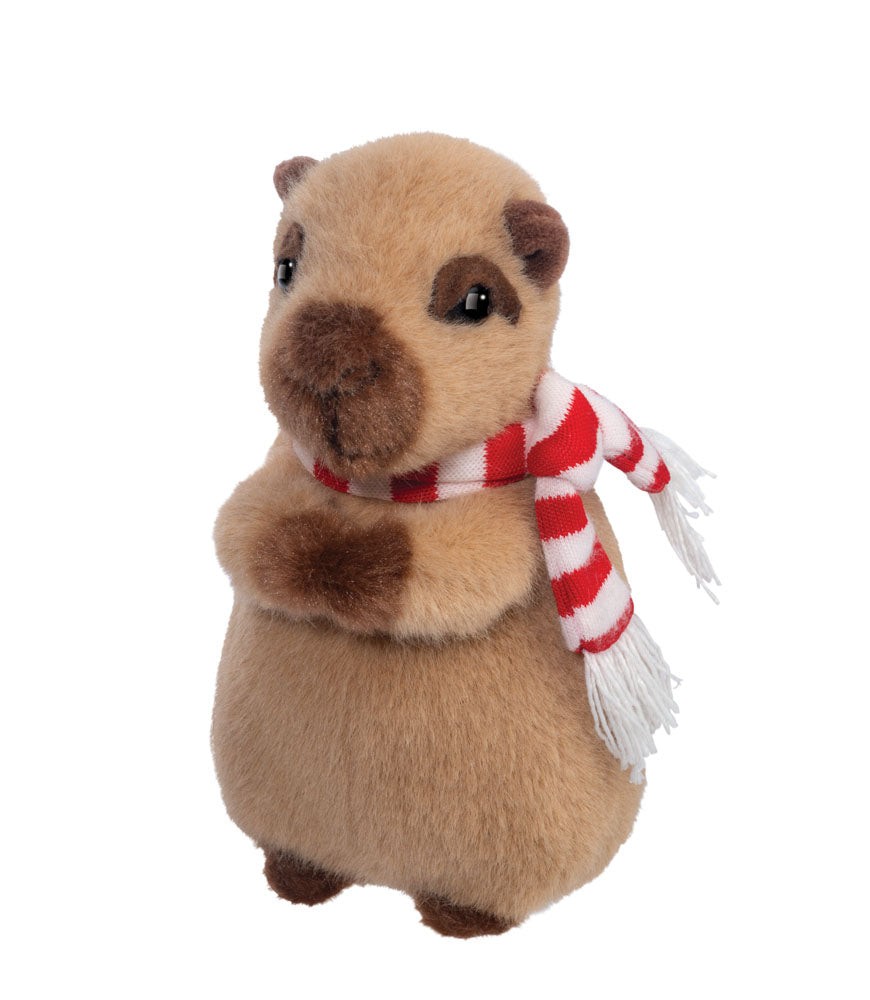 Plush toy capybara wearing a red and white striped scarf on a white background