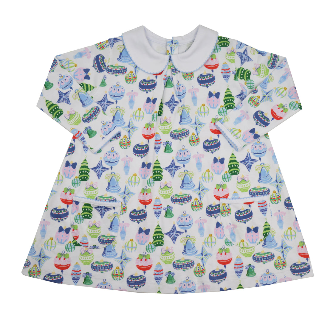 A short-sleeve baby dress with a white Peter Pan collar, featuring an all-over colorful Christmas ornament pattern on a white background.