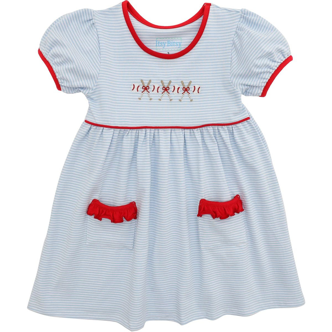 Children's dress with red accents and embroidery on a white background