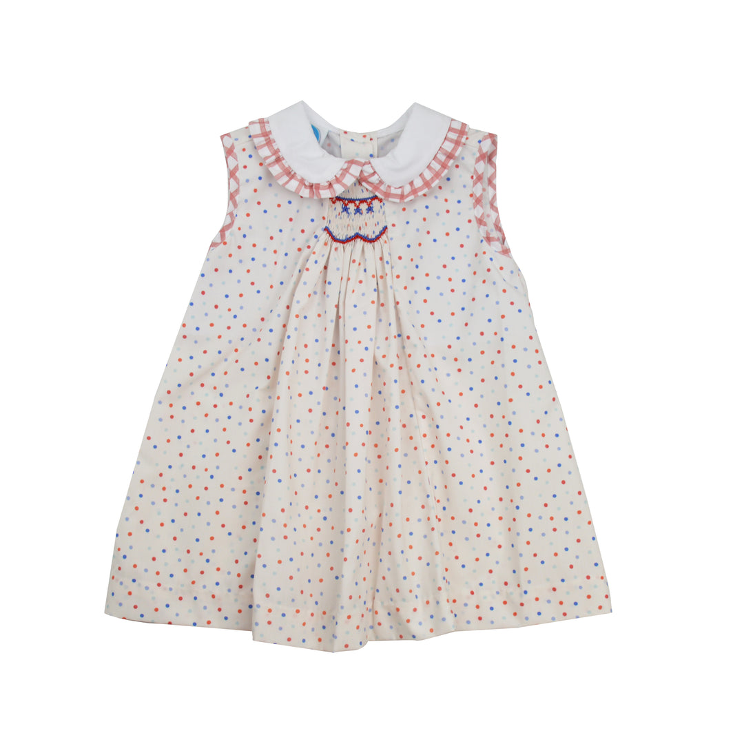Children's dress with a colorful polka dot pattern on a white background