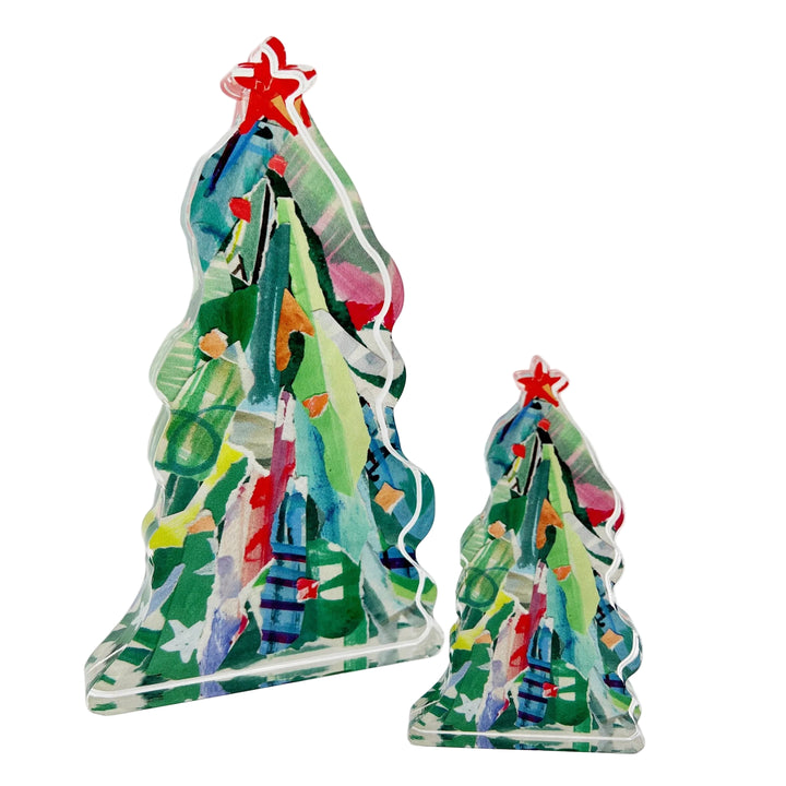 Two colorful Christmas tree figurines on a white background
