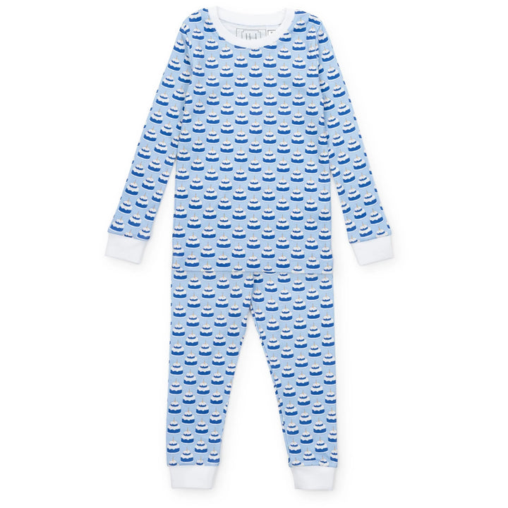 Blue and white birthday cake patterned pajama set on a white background