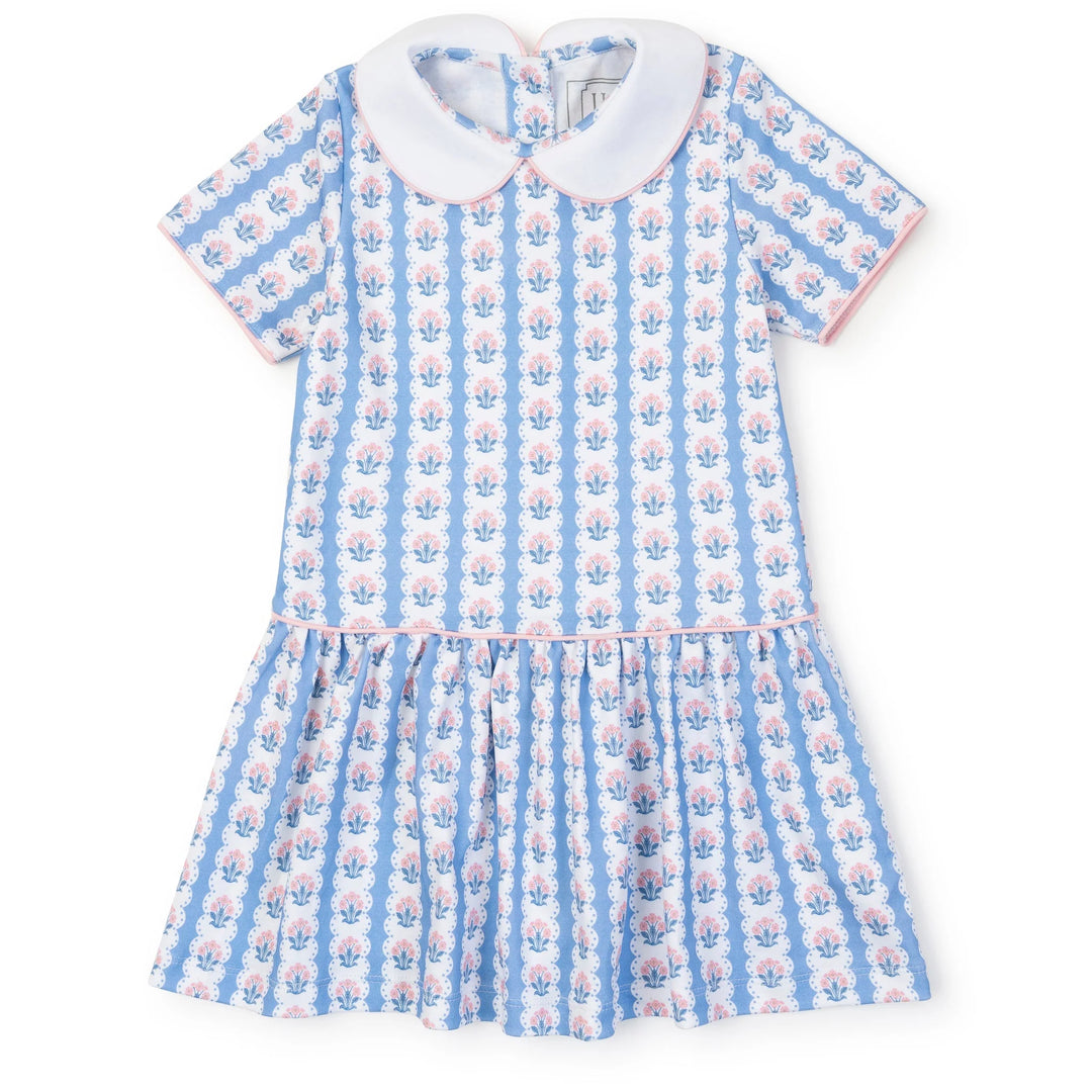 Children's dress with blue and pink floral pattern on a white background