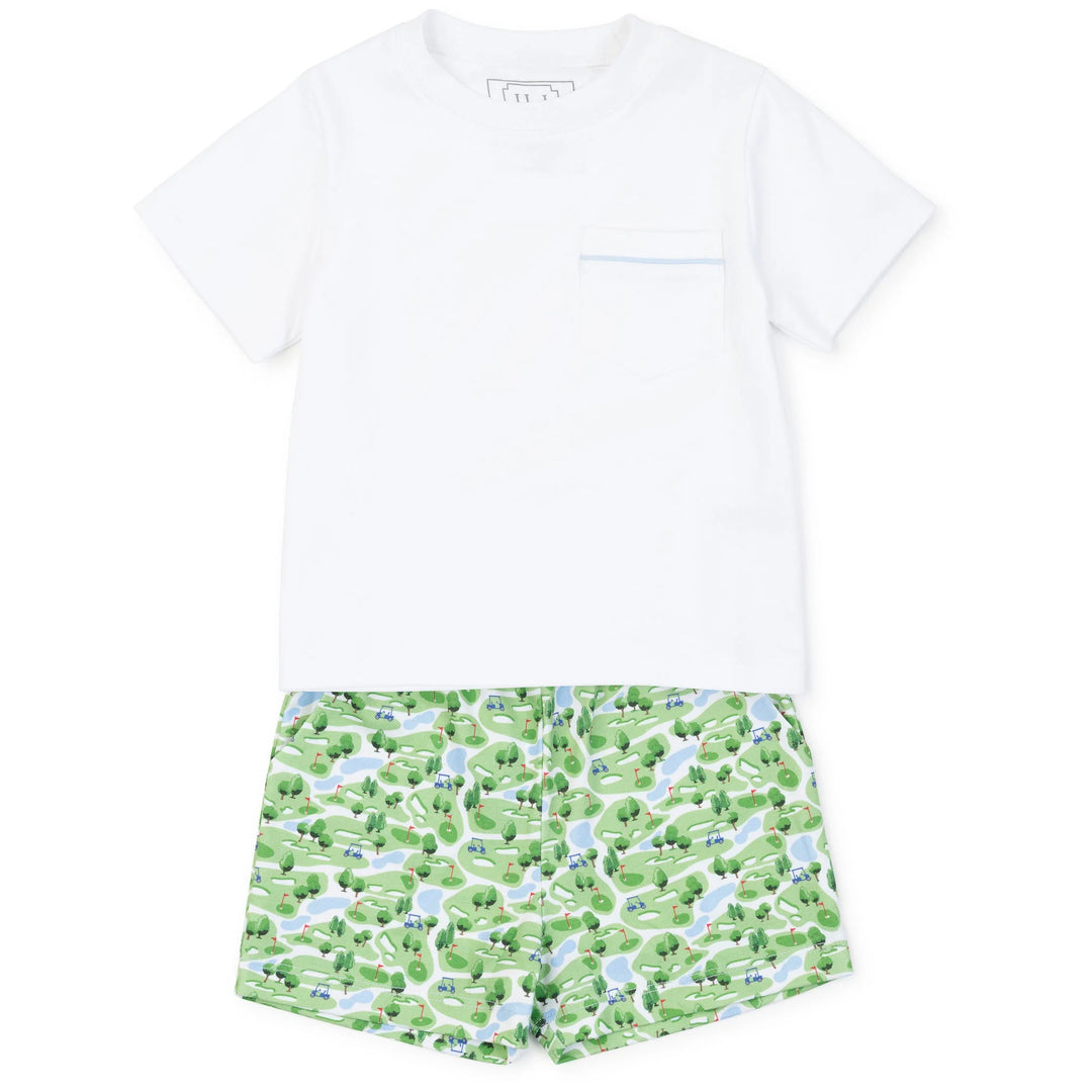 A children's two-piece outfit set featuring a solid white short-sleeve t-shirt with a chest pocket and green dinosaur-print shorts on a white background.
