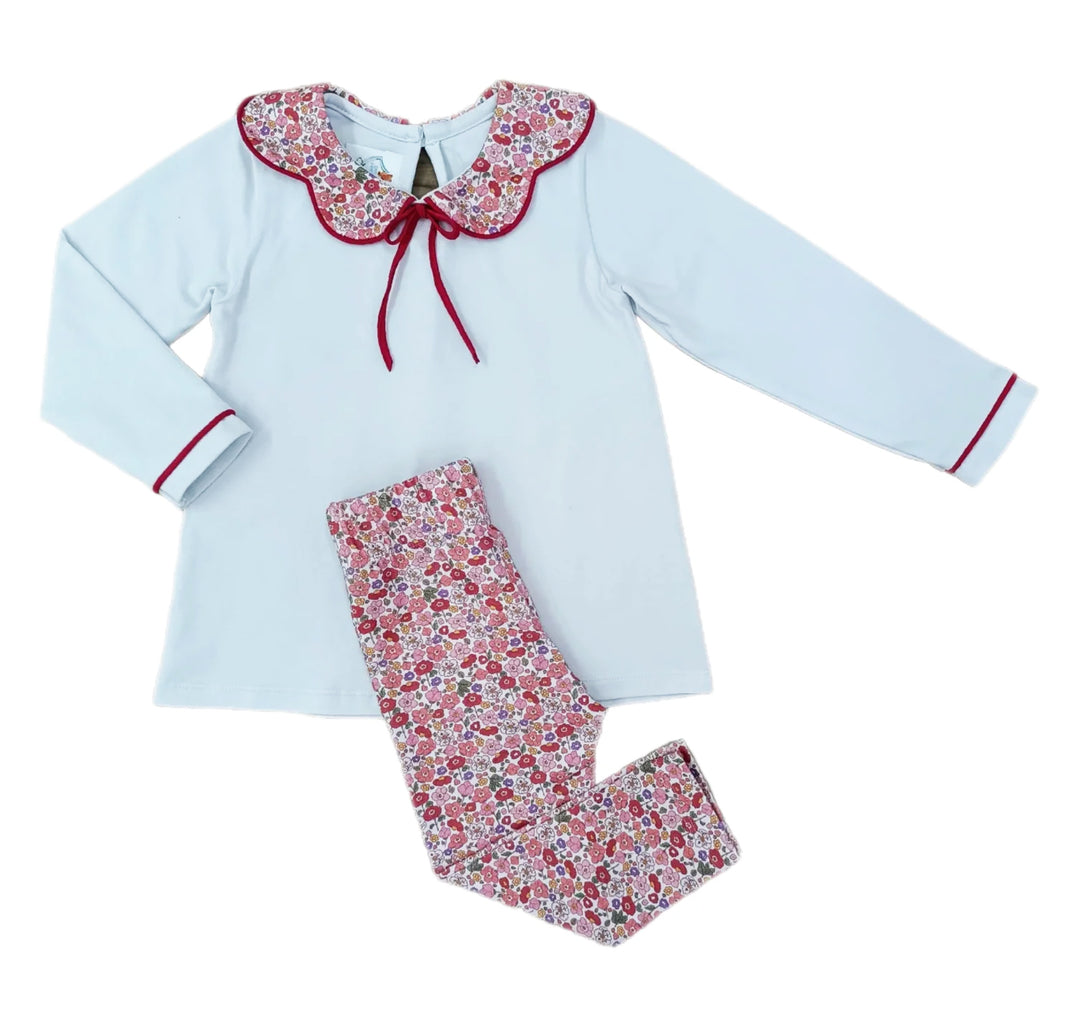 Children's outfit with floral top and pants on a white background
