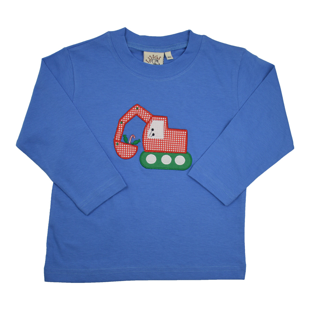 A royal blue long-sleeve t-shirt for toddlers, featuring a colorful applique of a red and white gingham excavator with green tracks on the front chest. The brand tag &