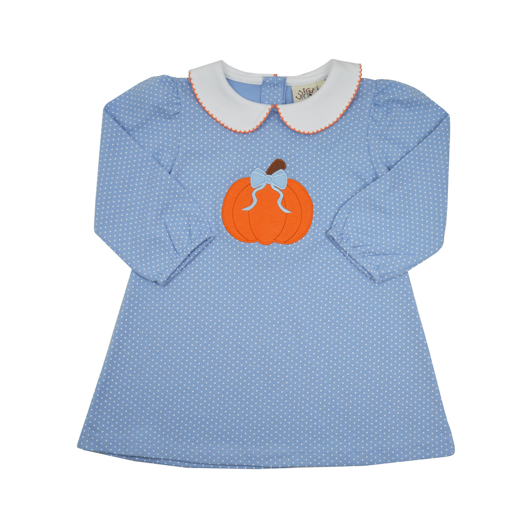 A light blue long-sleeve dress with a white Peter Pan collar, decorated with a central orange pumpkin applique featuring a small brown stem and white leaf details, set against a plain white background.