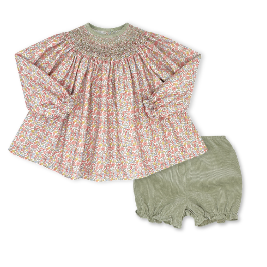 Floral top and green shorts set on a white background