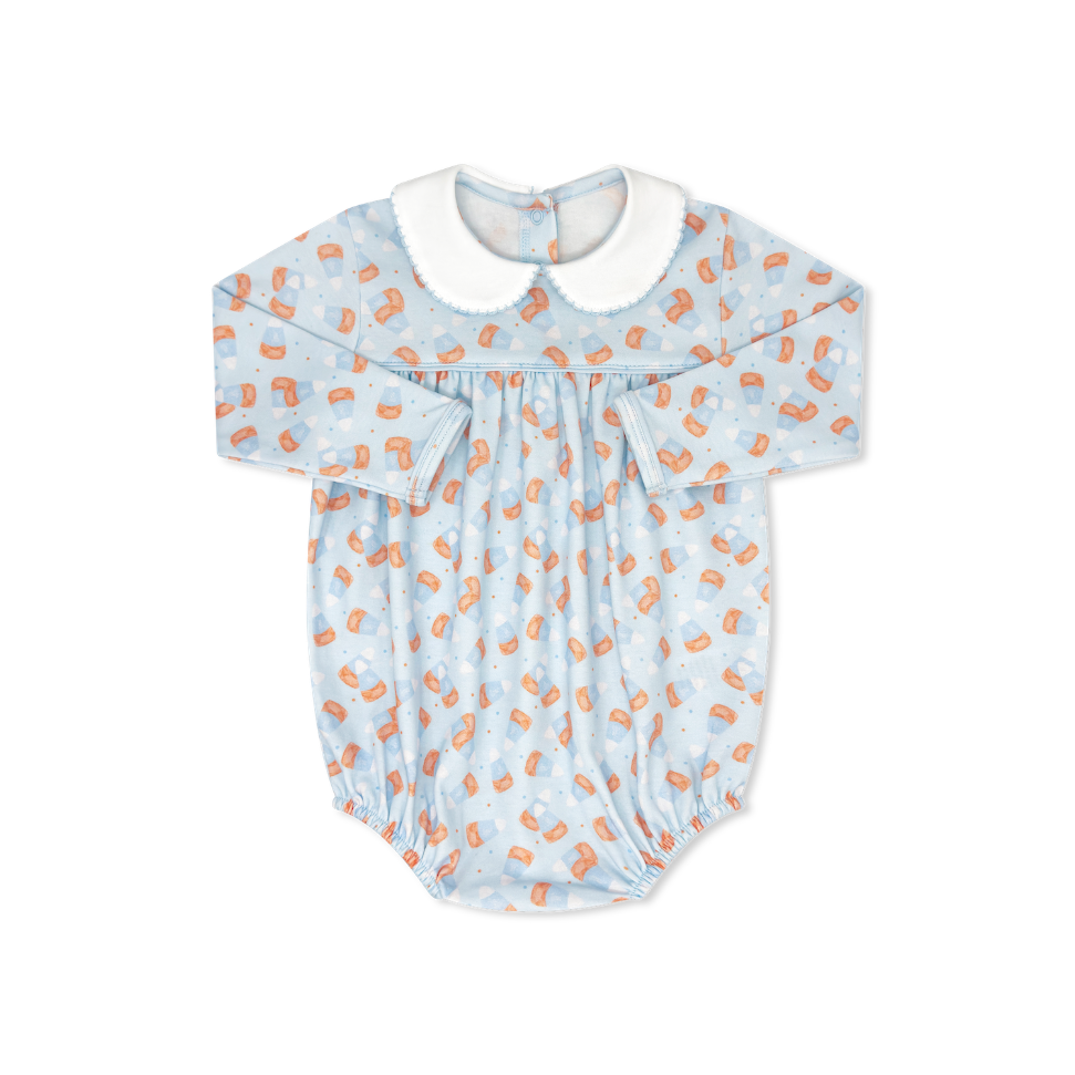 Baby romper with orange pattern on a white background