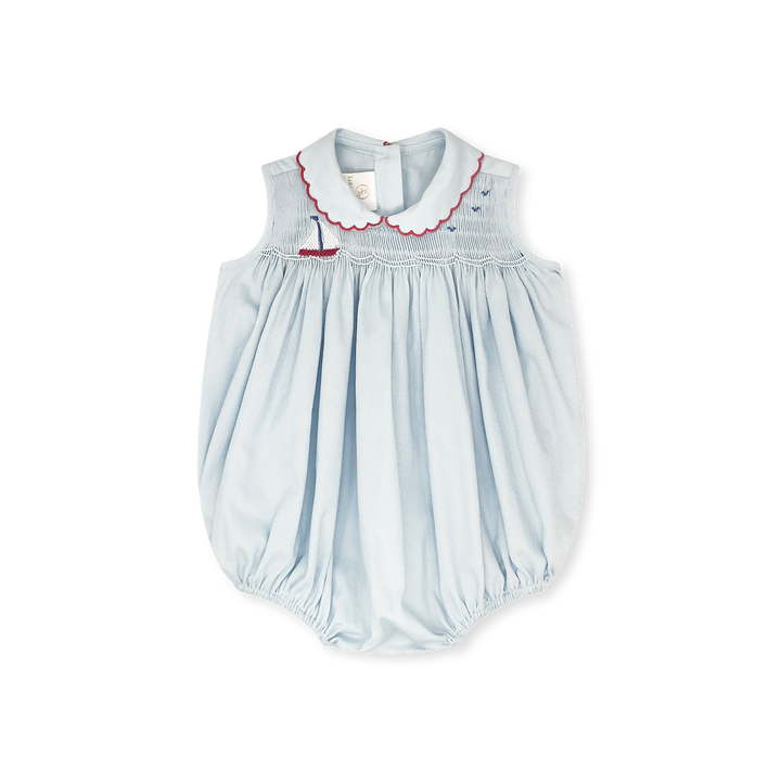 Light blue baby romper with red trim on a white background