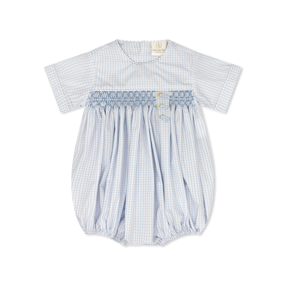 Baby romper with blue and white check pattern on a white background