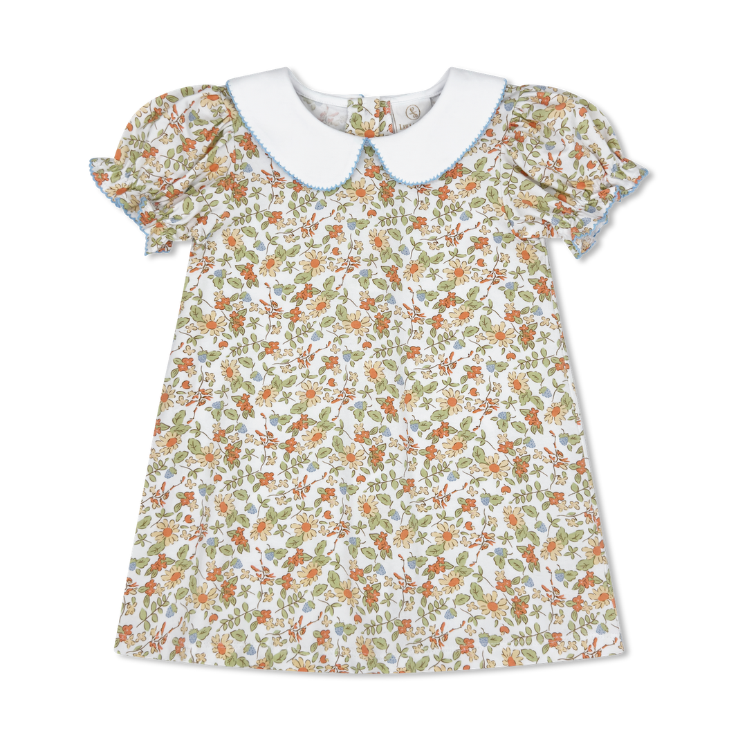 Floral dress with a white collar on a white background