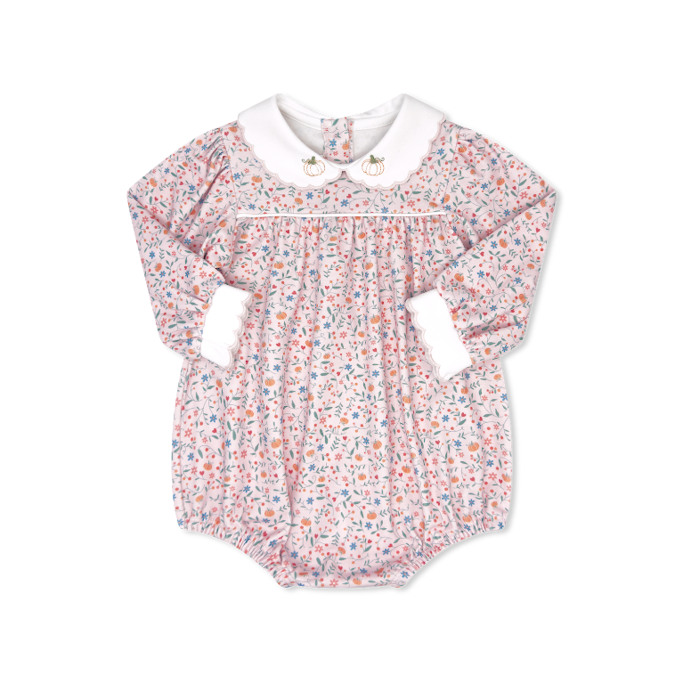 Floral baby romper with a white collar on a white background