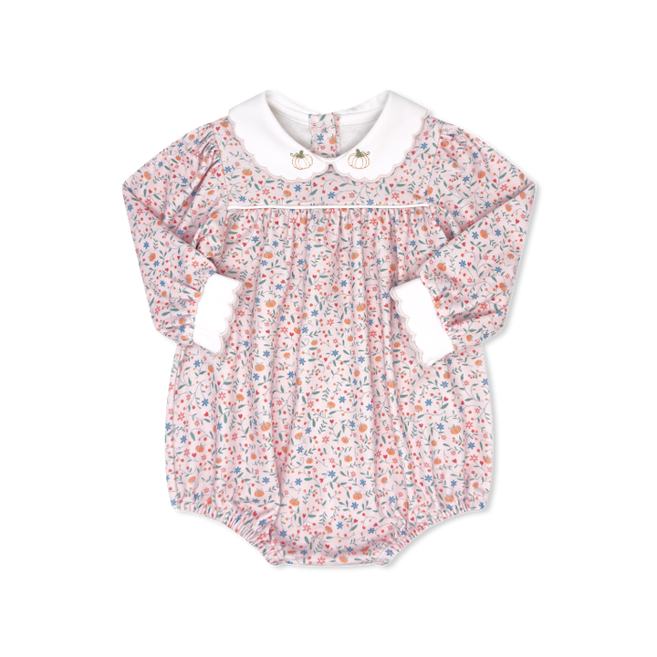 Floral baby romper with a white collar on a white background