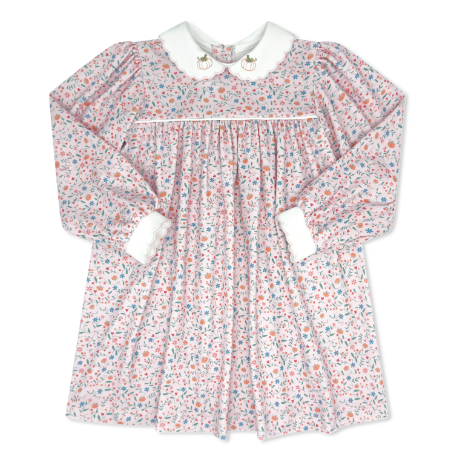 Floral dress with long sleeves and white collar on a white background