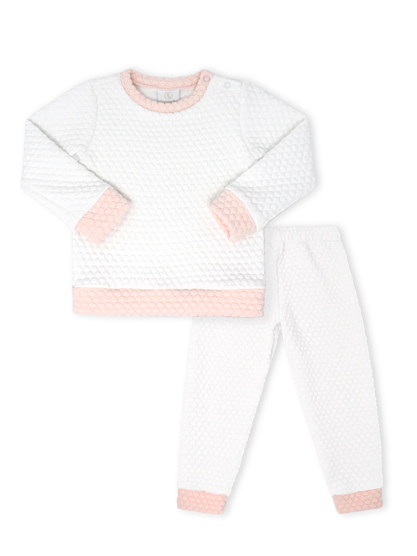 White long-sleeve shirt with pink accents on a white background
