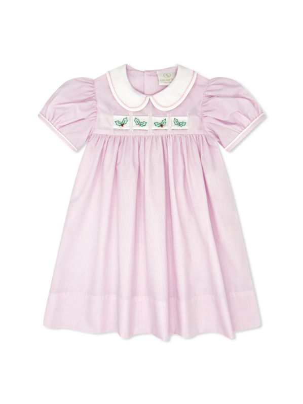 Pink dress with white collar and green embroidery on a white background