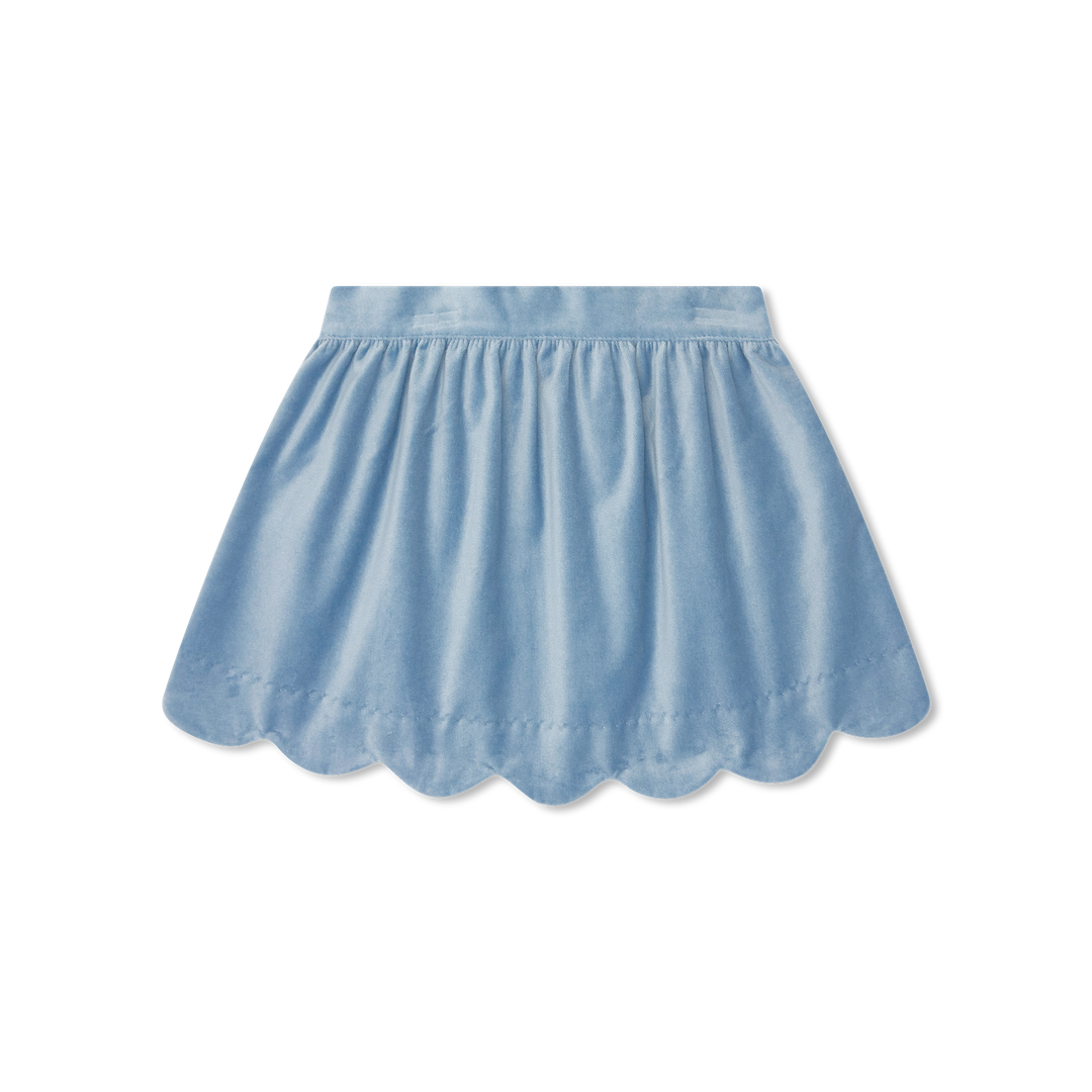 A light blue cotton skirt with a scalloped hem and gathered waistband, shown flat against a white background.