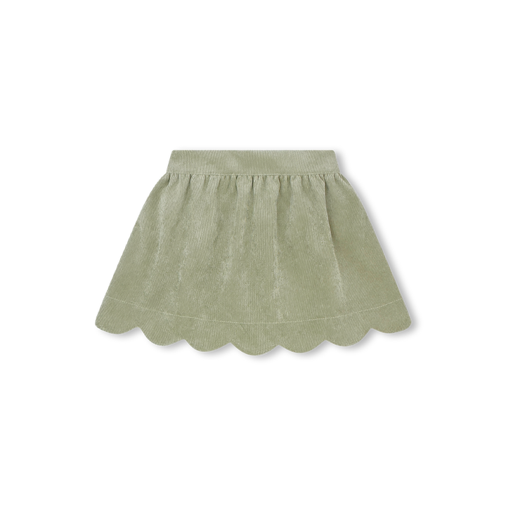 Green skirt with scalloped hem on a white background