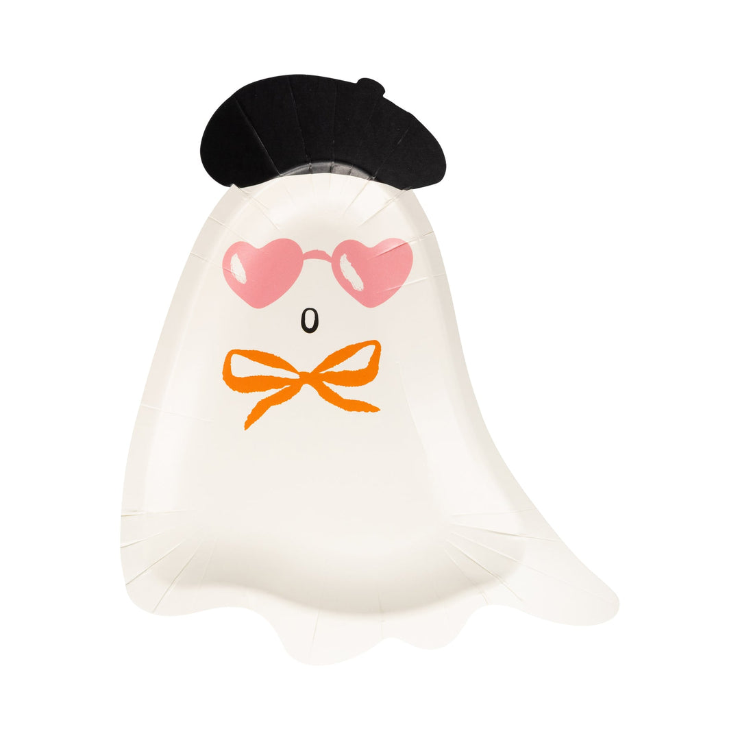 Ghost-shaped pillow with a black beret, pink heart sunglasses, and orange bow tie on a white background
