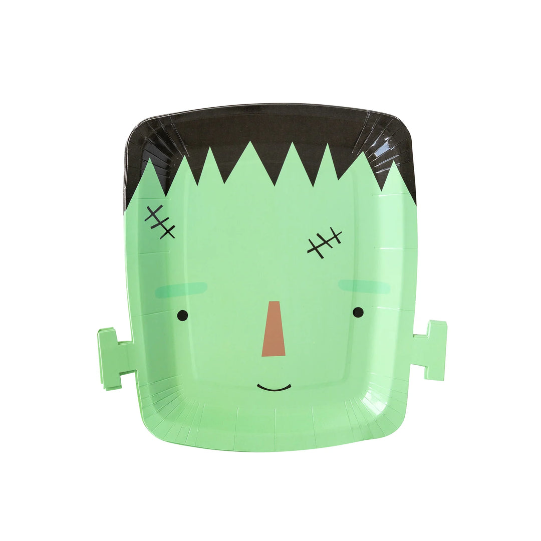 Green paper plate with a Frankenstein design on a white background