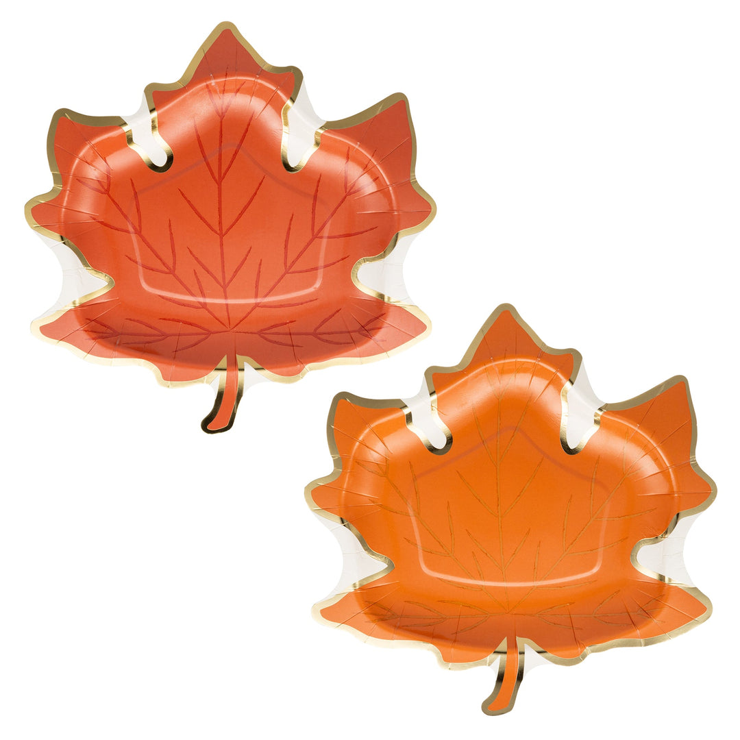 Two orange leaf-shaped plates on a white background