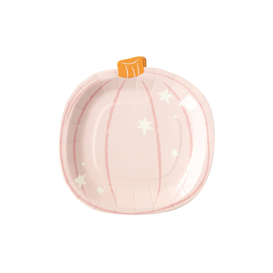 A light pink pumpkin-shaped paper plate with a small orange handle and white star patterns, shown on a plain white background.