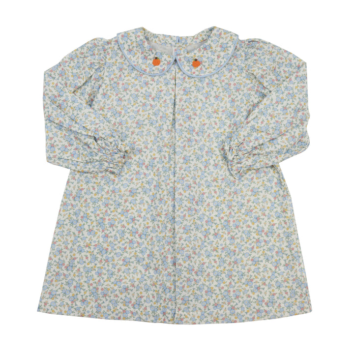 Floral patterned dress with long sleeves on a white background