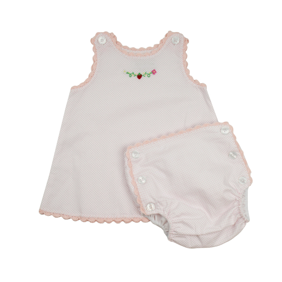 Baby dress and bloomers set with pink trim on a white background