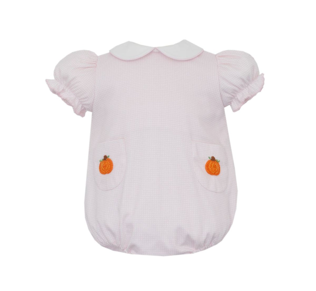 Light pink baby romper with pumpkin appliqués on a white background