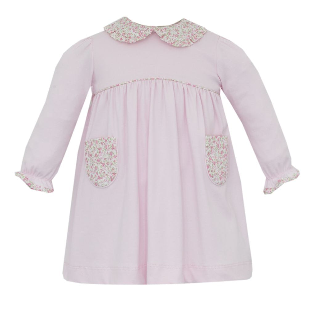 Pink dress with floral details on a white background
