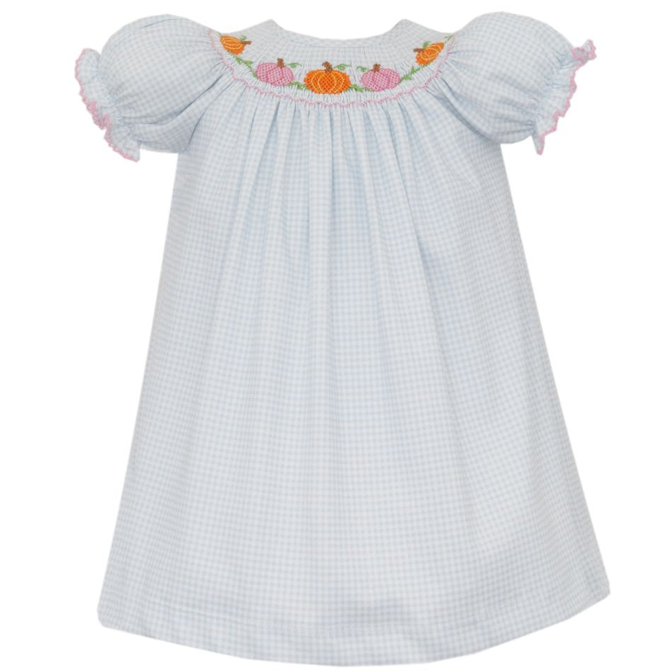 White checkered dress with embroidered pumpkin design on a white background