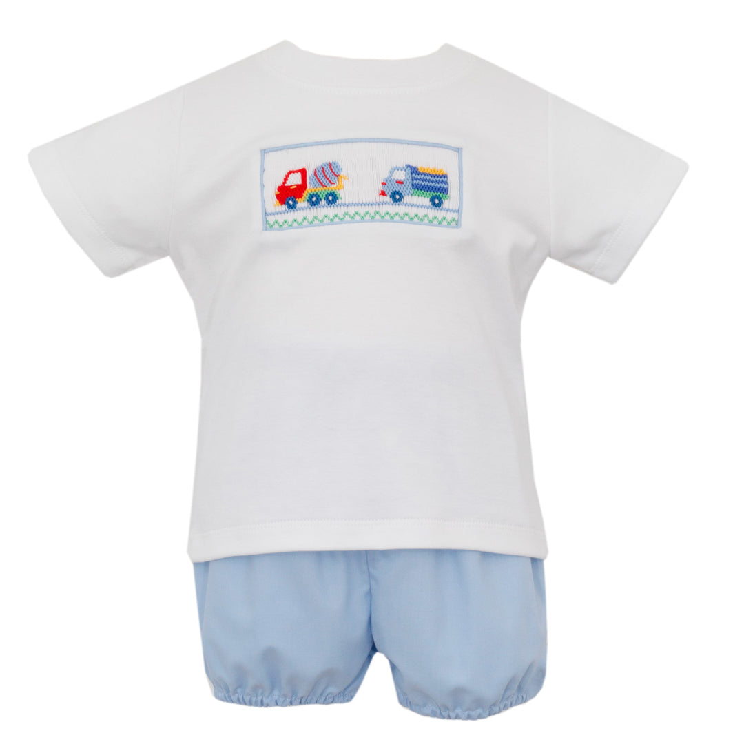 Children's outfit with white shirt and blue shorts featuring embroidered truck designs on a white background.