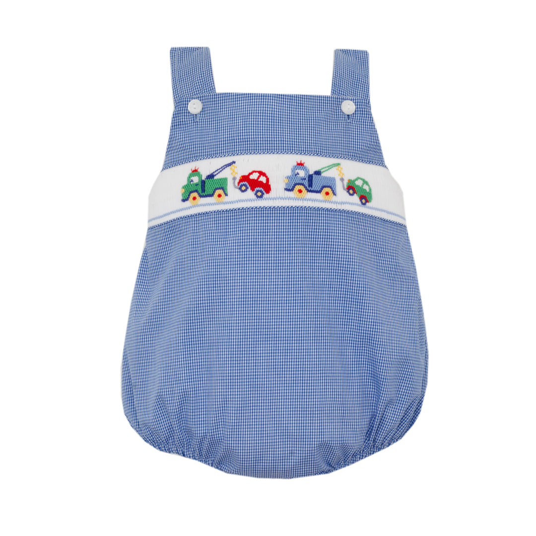 Blue checkered baby romper with colorful train design on a white background