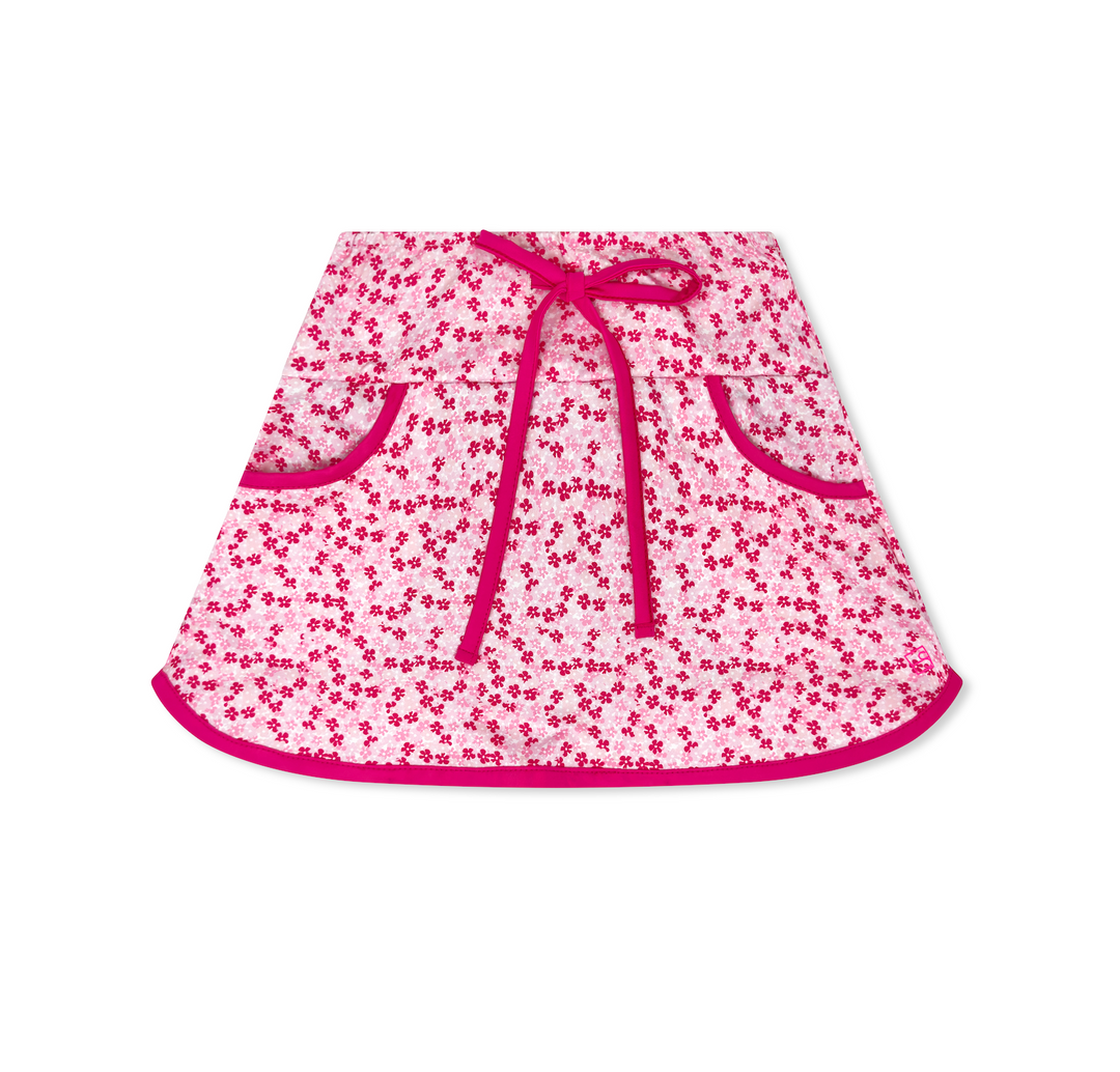 Pink floral skirt with a tie waist on a white background